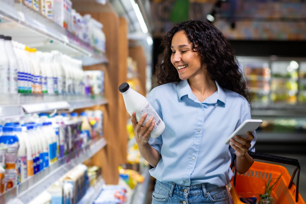 Sustainability-in-CPG-Smiling-Woman-Shopping-scaled